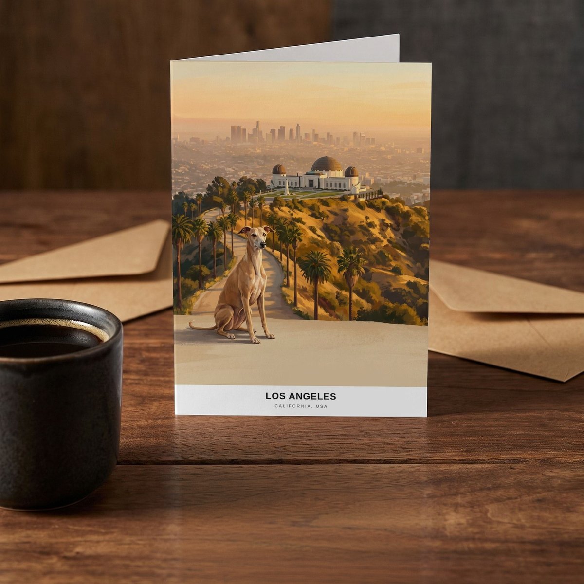 A folded card standing on a rustic wood table beside a mug of coffee
