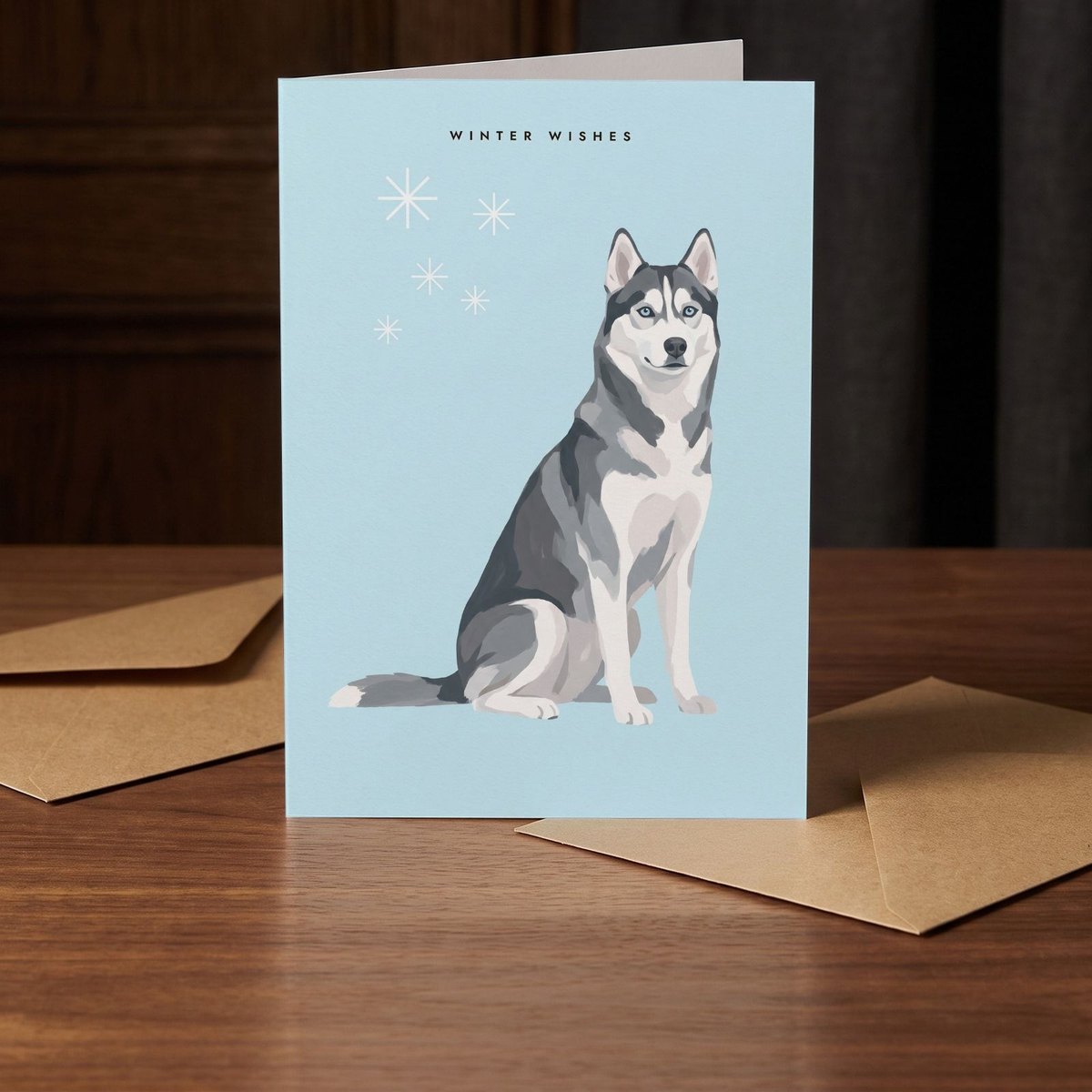 A folded card standing on a warm walnut table in a dim room